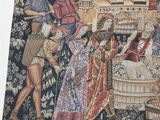 a tapestry with a picture of a man and a woman in a wine cellar