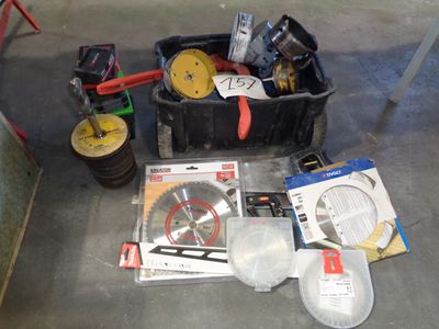 a box of tools sitting on the floor next to a box of tools