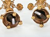 pair of antique brass candlesticks with black glass in the center