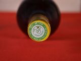 a bottle of wine that is sitting on a table