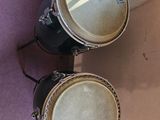 two drums that are hanging on the wall