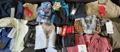 a suitcase full of clothes and other items that are on the floor