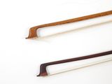 two different types of bows on a white surface