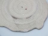 a white plate with a cracky design on it