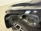a close up of a car ' s rear end with the door open