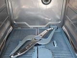 a pair of pliers sitting on the inside of an oven