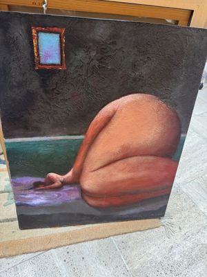 a painting of a woman laying down on the ground