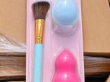 a pink and blue brush and a blue and white brush in a package