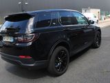 a picture of a black suv parked in a parking lot