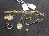 a close up of a bunch of jewelry on a table