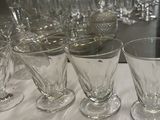 a lot of empty wine glasses on the table