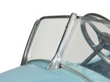 a close up of a blue car with a steering wheel