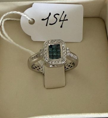 an image of a diamond ring in a box with a price tag