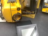 a picture of a camera and a monitor on a table