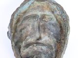 sculpture of a man ' s face on a white background