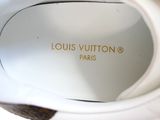 a close up of a pair of white shoes