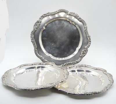 two silver plate with a silver rim and a silver plate with a silver rim and a silver plate with a silver rim and a silver plate with a silver rim