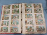 an open book with pictures of different buildings on it