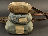 three bags stacked on top of each other on a table