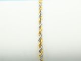 a close up of a yellow and white bracelet on a napkin