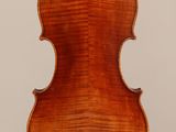 an old violin with a wooden back and a long neck