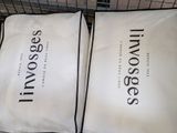 two pillows that are sitting on top of each other
