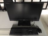 a desktop computer sitting on a desk with a keyboard and mouse