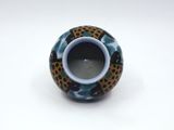 a blue and black vase with a leopard print design on it