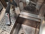 a sink that has a lot of bottles in it