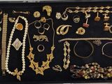 a black case with many different types of jewelry in it