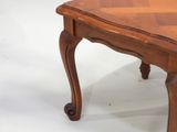 a wooden table with a checkered top on it
