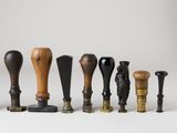 a lot of different types of knobs on a white surface