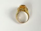 an image of a gold ring with a citrine stone in it