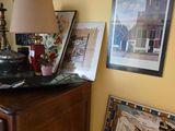 a dresser with a record player on top of it in a living room