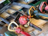 many different types of chainsaws sitting on a table