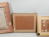 three framed pictures of a man and a woman sitting next to each other