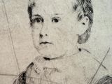 portrait of a young girl with a book by a window