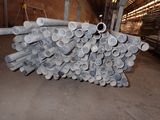 a pile of steel pipes stacked on top of each other