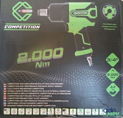 a box with a green and black power drill in it