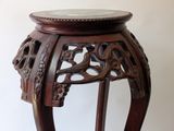 a wooden table with a marble top on it