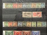 an image of a collection of stamps on display in a glass case