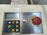 a control panel on a machine in a machine shop