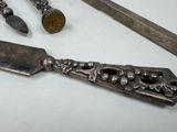 a knife and other tools that are on a table