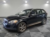 a picture of a black volvo suv parked in a garage
