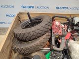a wooden box filled with assorted items including a lawn mower and a lawn mower