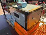 a machine that is on top of a cart in a store
