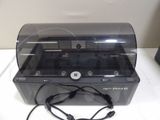 an image of a black and white printer on a white table