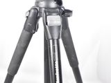 a tripod with a camera on it on a white background