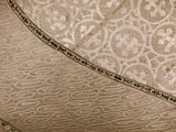 a close up view of a bed with a heart shaped comforter