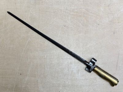 a small knife that is laying on a table